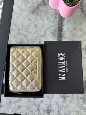 MZ Wallace passport organizer wallet
Champagne Candy never actually used stored